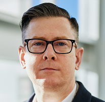 CEO Alexander Hughes, directeur van een cryptohandelsbedrijf, in portret